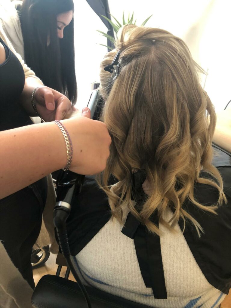 Stylist cutting hair